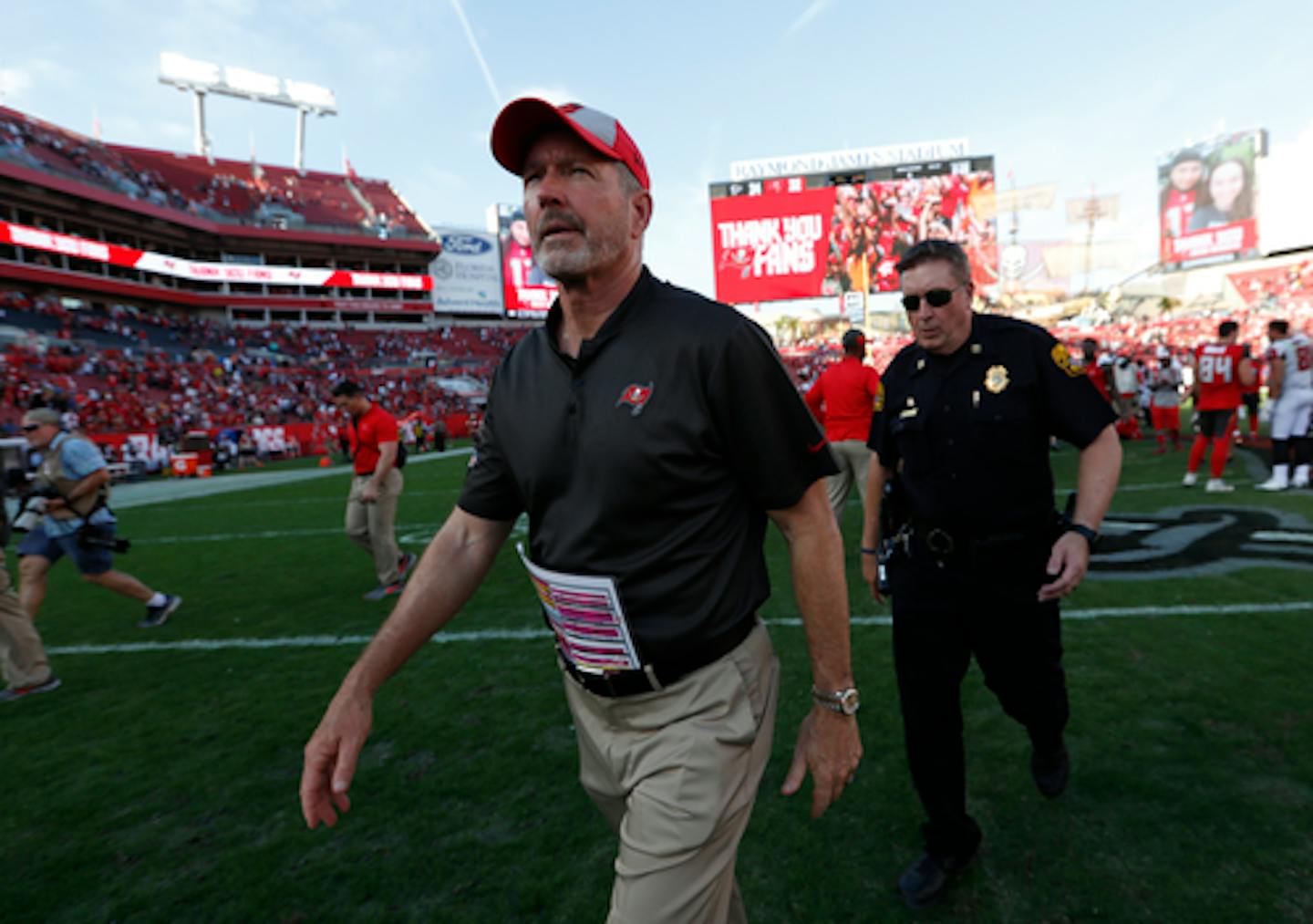 Tampa Bay Buccaneers head coach Dirk Koetter leaves the field after the team lost to the Atlanta Falcons during an NFL football game Sunday, Dec. 30, 2018, in Tampa, Fla. (AP Photo/Mark LoMoglio)