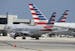 An American Airlines jet taxis to the gate at Miami International Airport, in Miami.