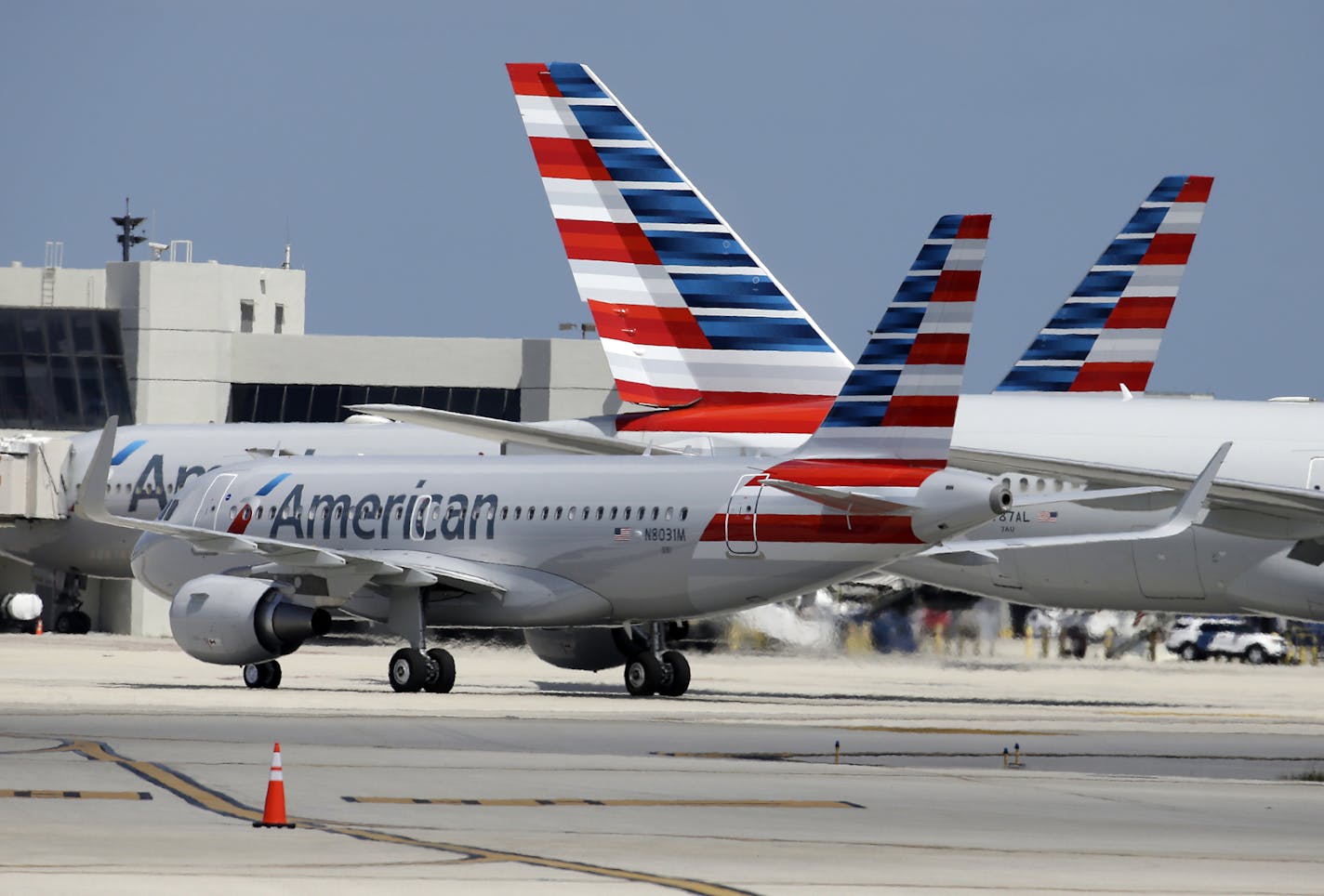 An American Airlines jet taxis to the gate at Miami International Airport, in Miami.