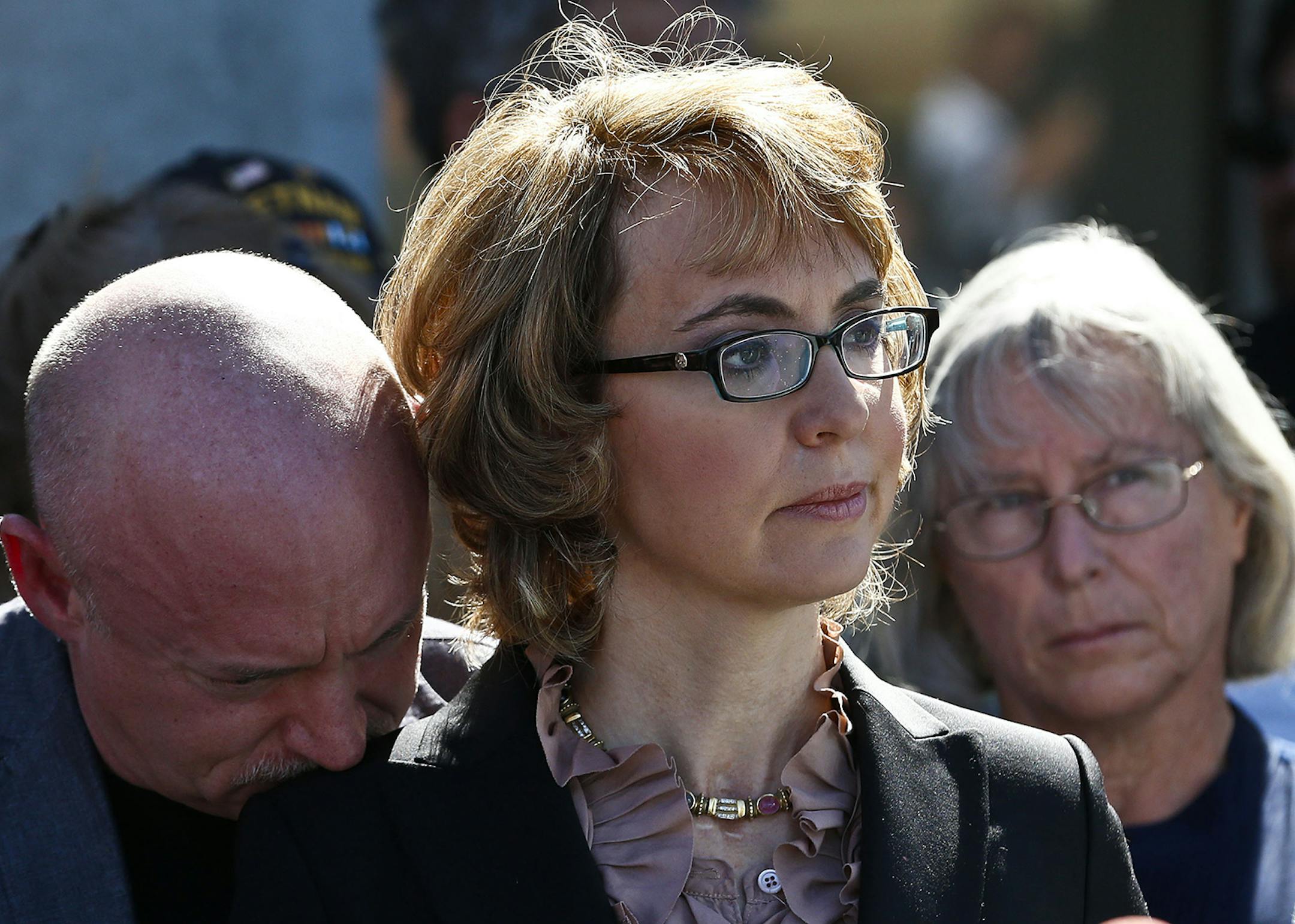 Former U.S. Rep. Gabrielle Giffords was joined by her husband, Mark Kelly, left, and Emily Nottingham, mother of shooting victim Gabe Zimmerman, at a visit in March to the site of the shooting that left Giffords critically wounded.