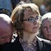 Former U.S. Rep. Gabrielle Giffords was joined by her husband, Mark Kelly, left, and Emily Nottingham, mother of shooting victim Gabe Zimmerman, at a 