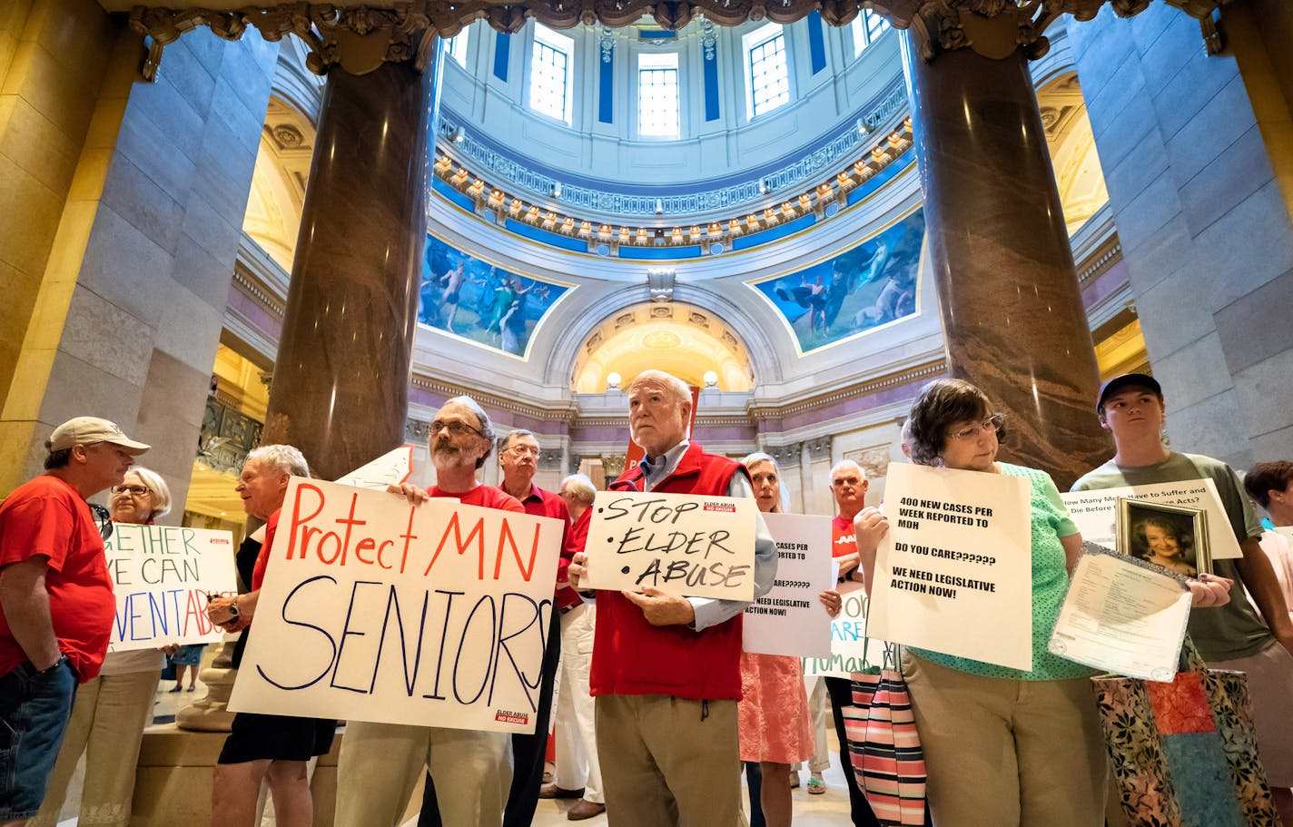 Families of elder abuse victims protested inaction by the Legislature on Friday. A few provisions made it into the budget bill.