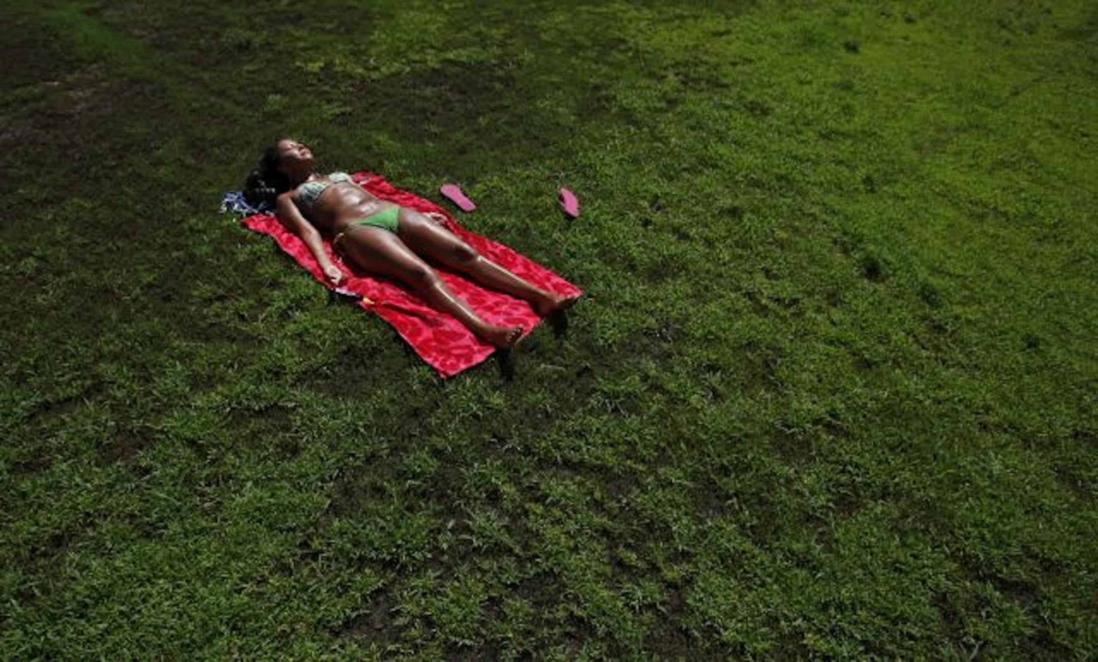 Bringing the heat: Leevon Decora of Minneapolis soaked up the sun in Bryant Square Park on Aug. 14 amid one of the month's many heat waves. It was the fifth-warmest summer recorded in the Twin Cities, and it was the third-warmest August.