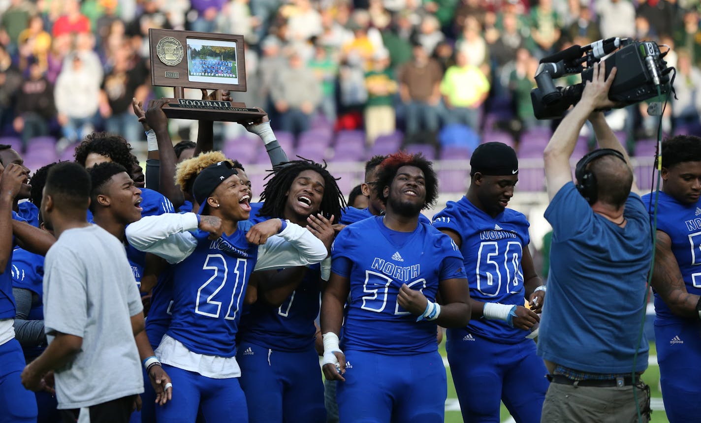 The Minneapolis North Polars celebrated with their championship trophy after defeating Rushford-Peterson 30-14 in the Class 1A title game. ] Shari L. Gross / sgross@startribune.com Minneapolis North defeated Rushford-Peterson 30-14 to earn their first title in the 1A football championship at U.S. Bank Stadium in Minneapolis, Minn. on Saturday, Nov. 26, 2016.