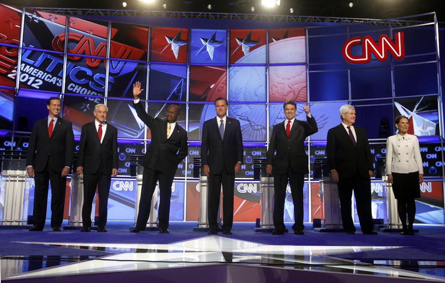 Republican presidential candidates, from left, Rick Santorum, Ron Paul, Herman Cain, Mitt Romney, Rick Perry, Newt Gingrich and Michele Bachmann at a Republican presidential debate Tuesday in Las Vegas.