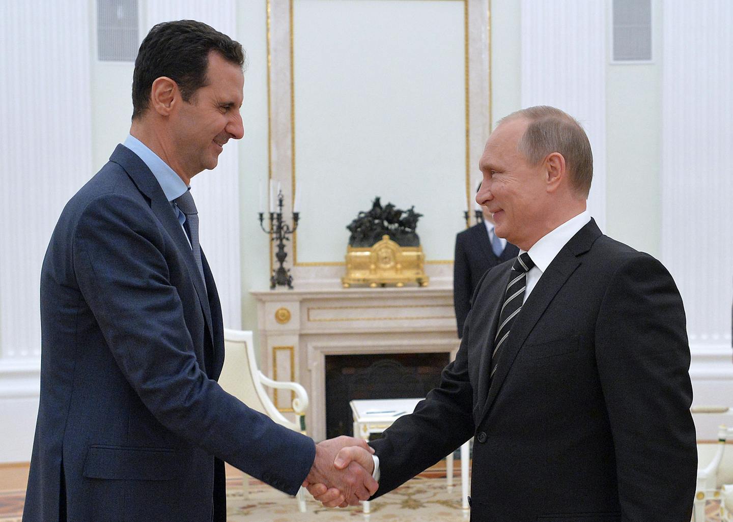 Syrian President Bashar al-Assad and Russian President Vladimir Putin shake hands during a meeting at Moscow's Kremlin late on Tuesday, Oct. 20, 2015. (Alexei Druzhinin/Russian Presidential Press and Information Office/Tass/Abaca Press/TNS) ORG XMIT: 1175491 ORG XMIT: MIN1510210934082740