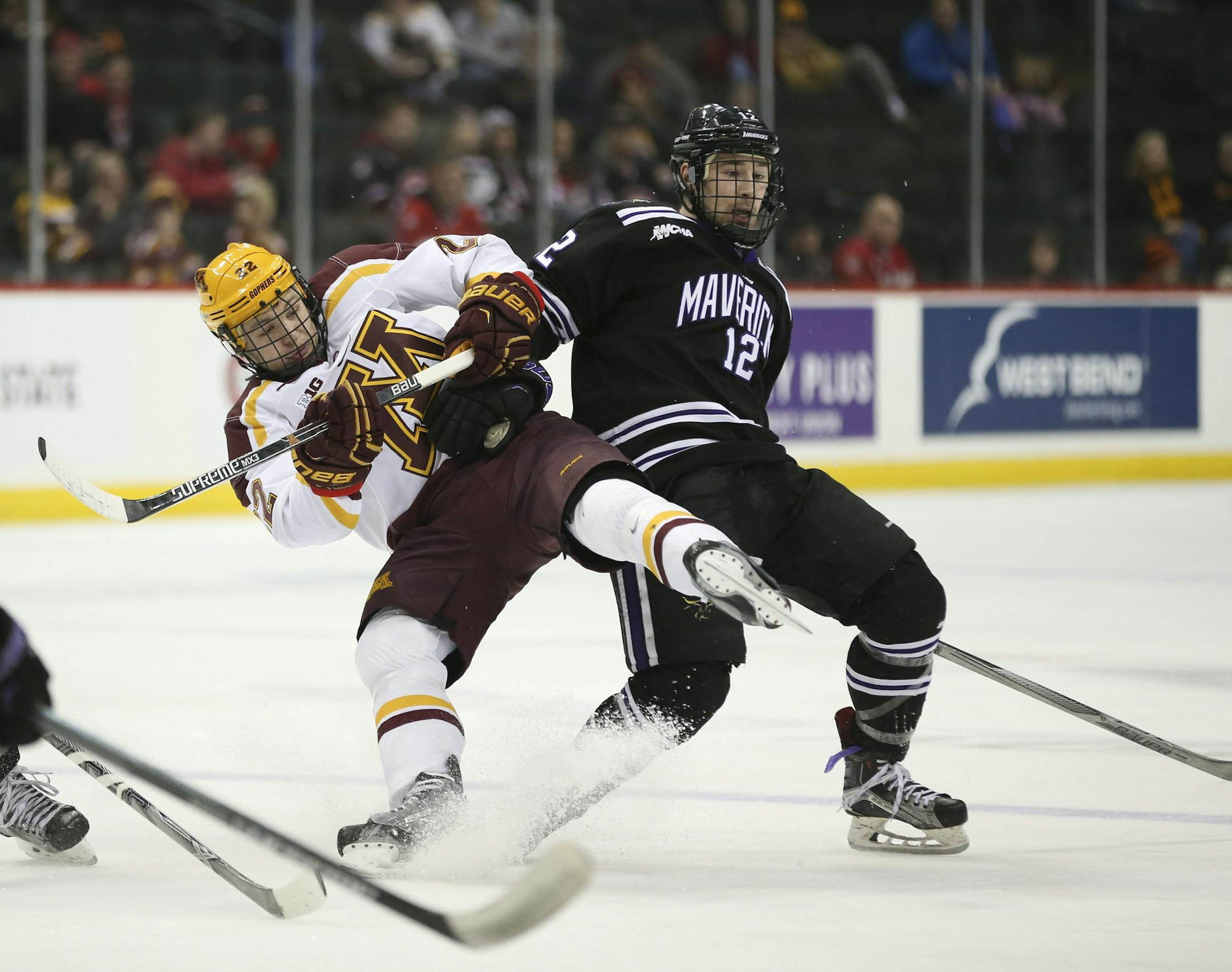 Gophers forward Tyler Sheehy (22) was taken out of a play by Mavericks forward Max Coatta (12) in the third period Sunday afternoon. ] JEFF WHEELER • jeff.wheeler@startribune.com The Minnesota State University Mankato beat the University of Minnesota 3-2 in the consolation game of the North Star College Cup tournament Sunday afternoon, January 31, 2016 at Xcel Energy Center in St. Paul.