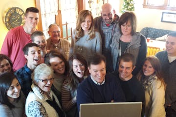 The Otto family gathers around the computer at Thanksgiving to Skype with Moriah Otto, who missed the family gathering in Cokato, Minn. becuase she wa