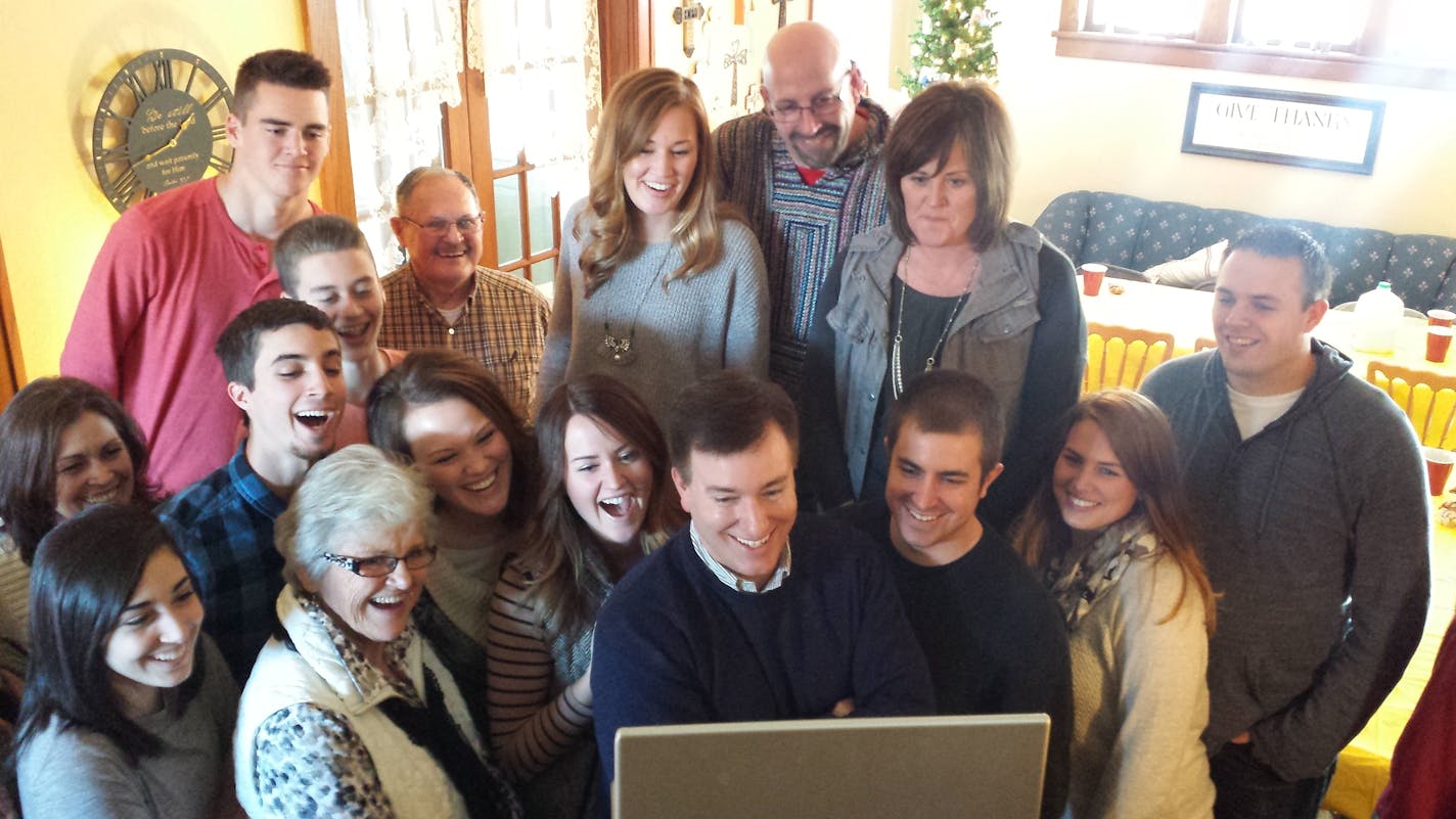 The Otto family gathers around the computer at Thanksgiving to Skype with Moriah Otto, who missed the family gathering in Cokato, Minn. becuase she was studying abroad in Kenya.