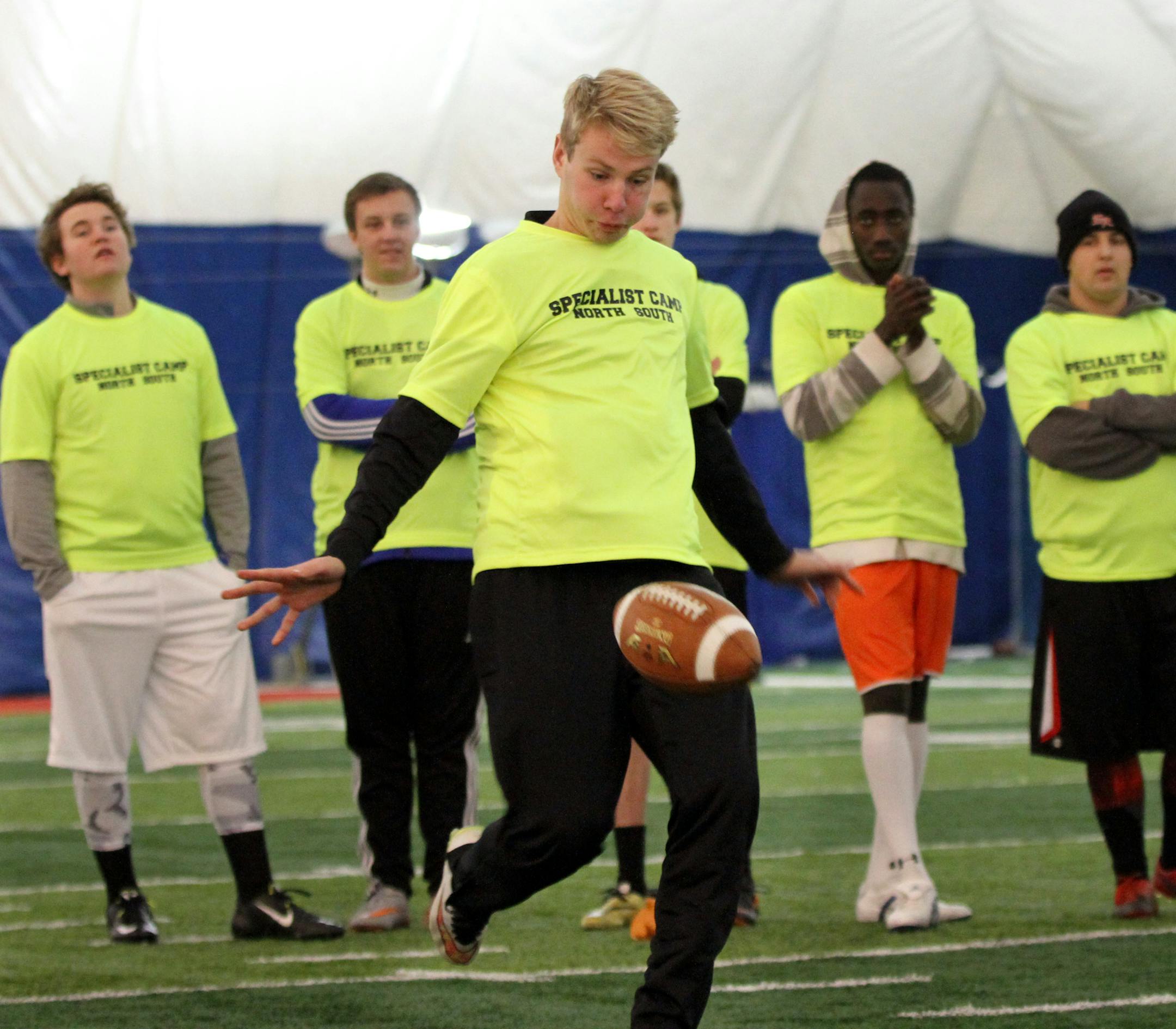 Dozens of football kickers from junior and senior high school and college took part in Special Teams Football Academyís Northern Specialist Camp at St. Cloud State University. The camp, one of many run by former Armstrong High School and University of St. Thomas kicker Chris Husby, is dedicated to the development of one of the most overlooked ñ often regrettably ñ parts of the high school game. Tommy Gallagher from Northfield High School boots a punt during a competition during th