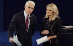 Moderators Anderson Cooper, of CNN, and Martha Raddatz, of ABC News talk to the audience before the second presidential debate at Washington Universit