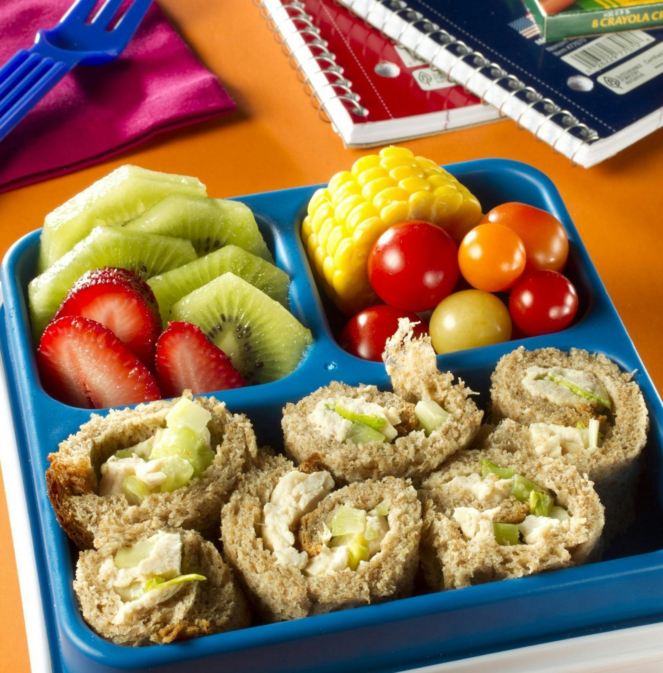 Chicken salad roll-ups served with fresh fruit and vegetables is a healthy, colorful lunch for school kids. (Tammy Ljungblad/Kansas City Star/MCT)