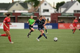 The Minnesota Aurora's Cat Rapp looks to play the ball against Indy Eleven on Friday in Detroit.