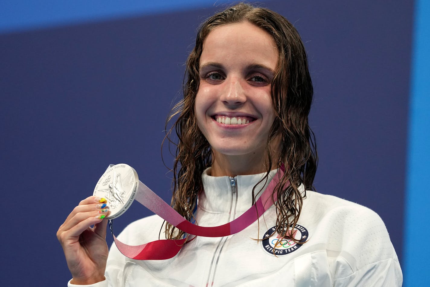 Regan Smith of the United States poses with her silver medal after the women's 200-meter butterfly final at the 2020 Summer Olympics