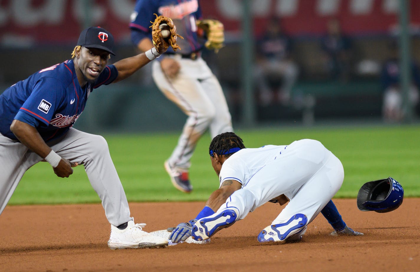 Kansas City Royals' Jarrod Dyson steals second base past Minnesota Twins second baseman Nick Gordon during the seventh inning of a baseball game Thursday, June 3, 2021, in Kansas City, Mo. (AP Photo/Reed Hoffmann)