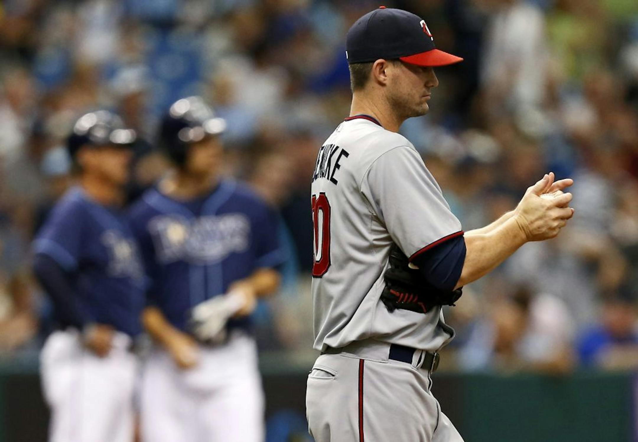Minnesota Twins relief pitcher Josh Roenicke reacts after giving up a triple to Tampa Bay Rays' Ben Zobrist during the seventh inning of a baseball game Thursday, July 11, 2013, in St. Petersburg, The Rays won 4-3. Fla.