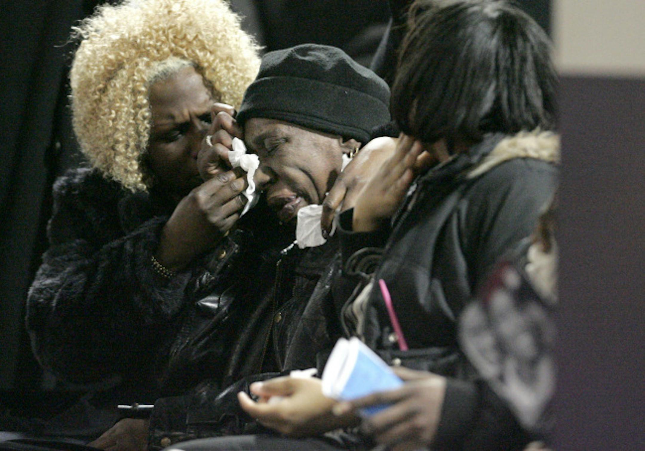 Mourners wept at the funeral for Demond Reed, 4, at Shiloh Temple in north Minneapolis on Monday night. Demond had come from Chicago to Minneapolis with his father to visit relatives. His father's cousin, now in jail, has been charged with the boy's fatal beating.