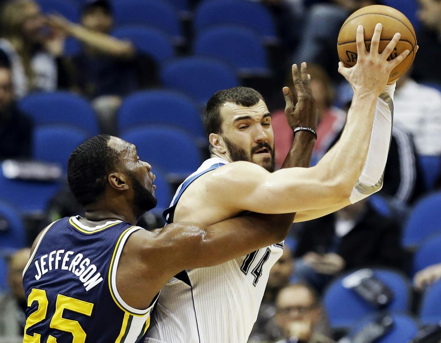 Utah's Al Jefferson, left, gets tangled up with theTimberwolves' Nikola Pekovic.