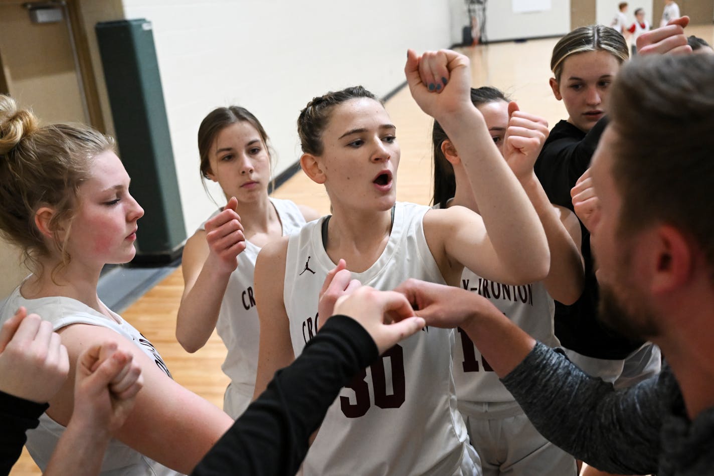 Crosby-Ironton's Tori Oehrlein rallies her team in the huddle before taking on Holy Family Saturday, Feb. 4, 2023 at Holy Family High School in Victoria, Minn. Oehrlein is one of two girls racing to be the first 9th grader to score 2,000 points in state history. She tacked on 36 more points during Saturday's game, despite losing to Holy Family 66-53. ] AARON LAVINSKY • aaron.lavinsky@startribune.com