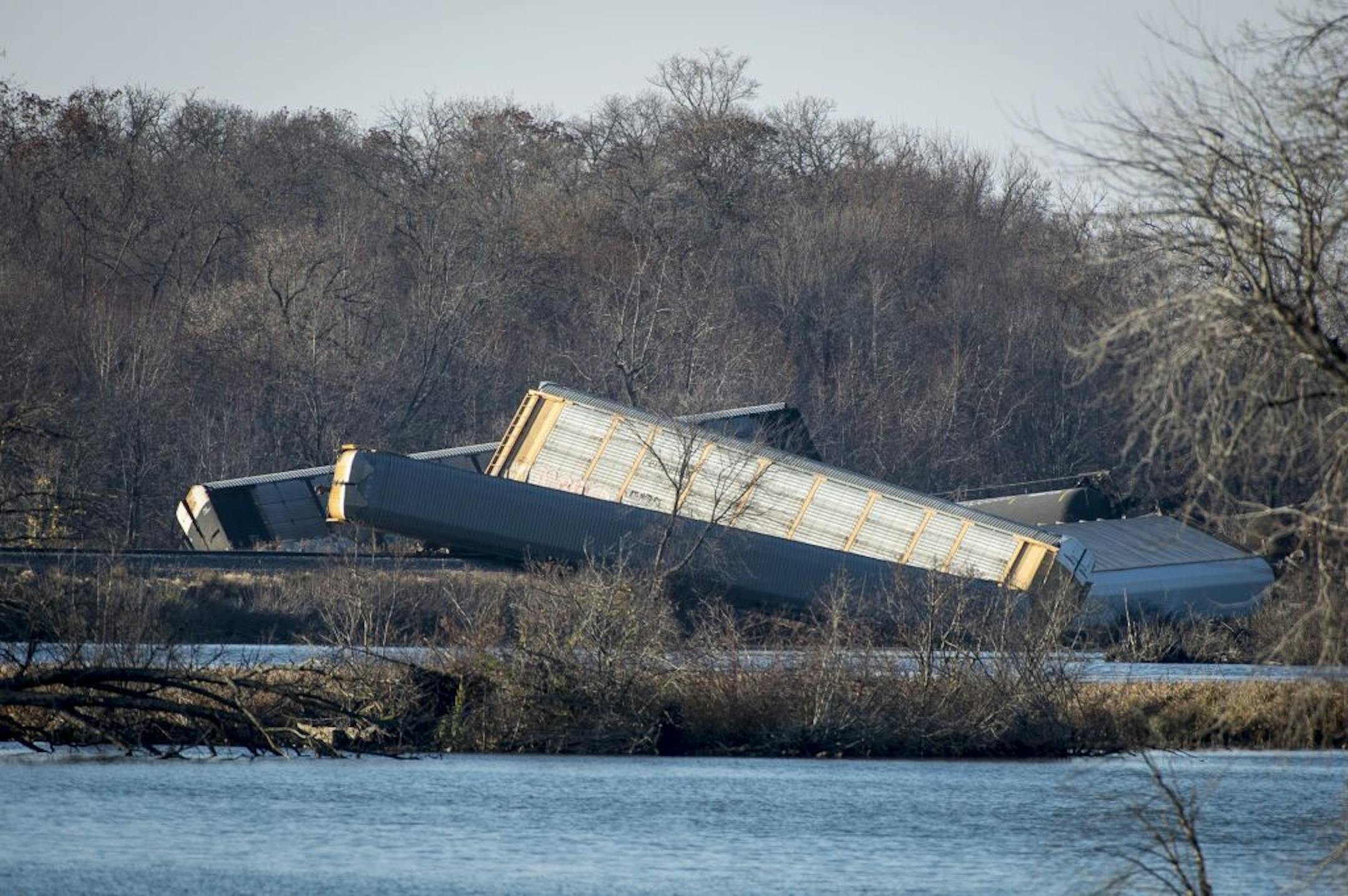 Train cars were overturned outside of Alma with some cars in the Mississippi River after a derailment Saturday.