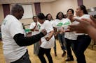 Nurse practitioner Kumba Kanu, center, danced with a group of fellow nurses from the Sierra Leone Nurses Association during Friday night's free health