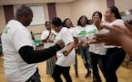 Nurse practitioner Kumba Kanu, center, danced with a group of fellow nurses from the Sierra Leone Nurses Association during Friday night's free health