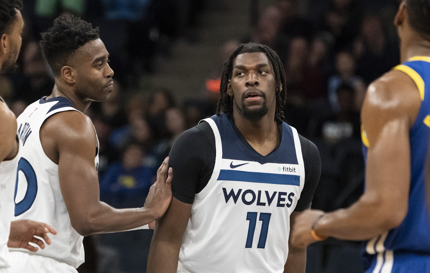 Minnesota Timberwolves center Naz Reid (11) was congratulated by Minnesota Timberwolves forward Kelan Martin (30) after a three-point shot in the first half. ] RENEE JONES SCHNEIDER &#xa5; renee.jones@startribune.com The Minnesota Timberwolves hosted the Golden State Warriors at the Target Center in Minneapolis, Minn., on Thursday, January 2, 2020.