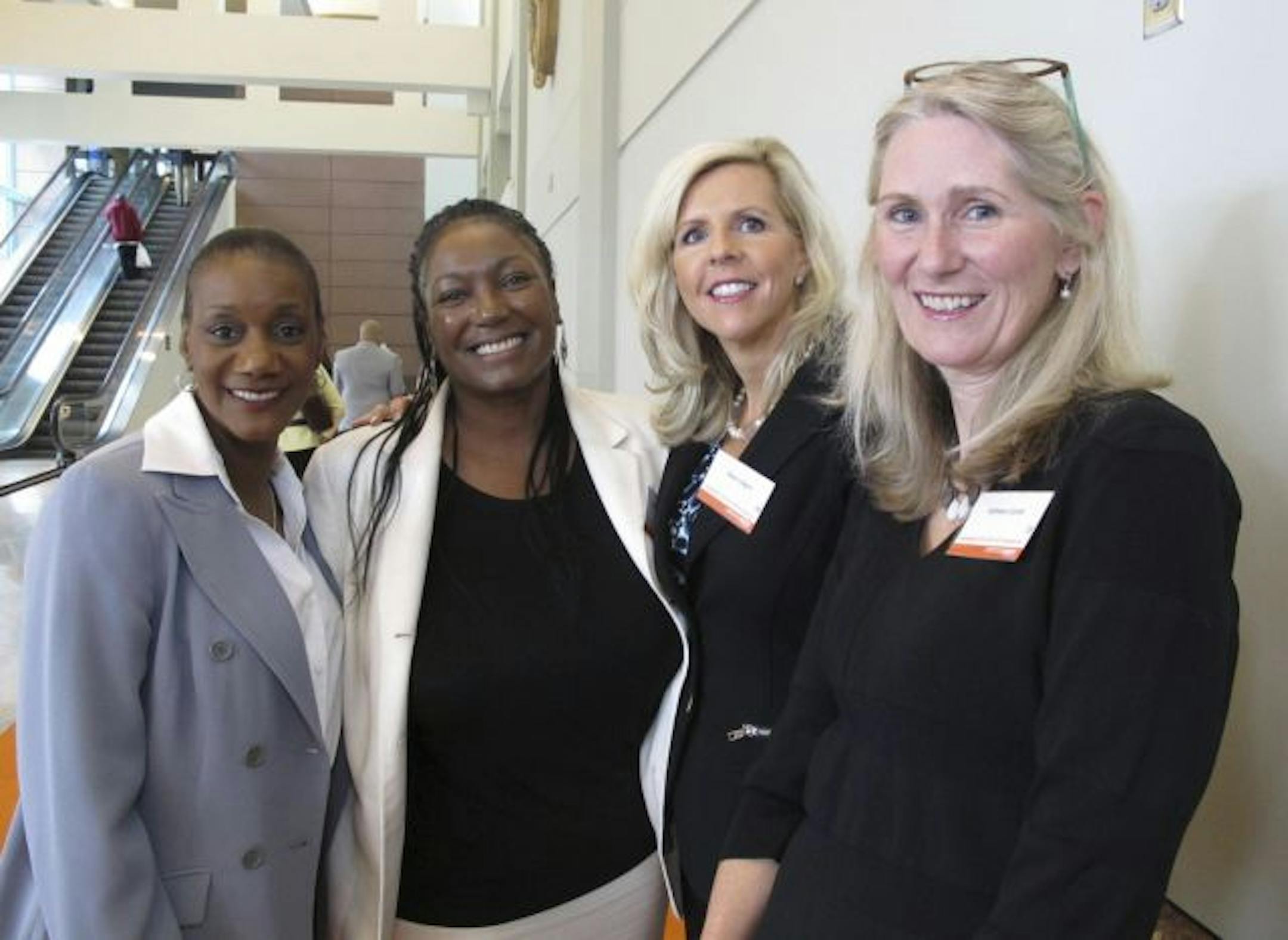 The 14th annual Circle of Women luncheon for YWCA of Minneapolis. Bobbi Davis, Shelly Carthen Watson, Karen Lofgren and Kathleen Curran