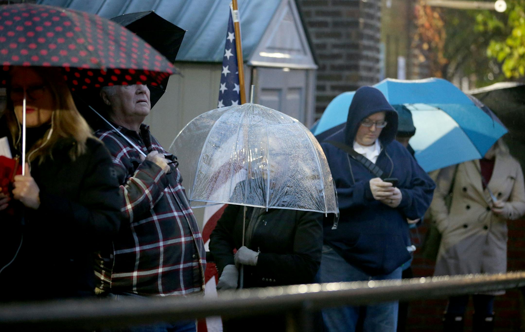 Voters wait in line for the polling place to open Tuesday, Nov. 6, 2018, at Emerson Spanish Immersion School in Minneapolis, MN.