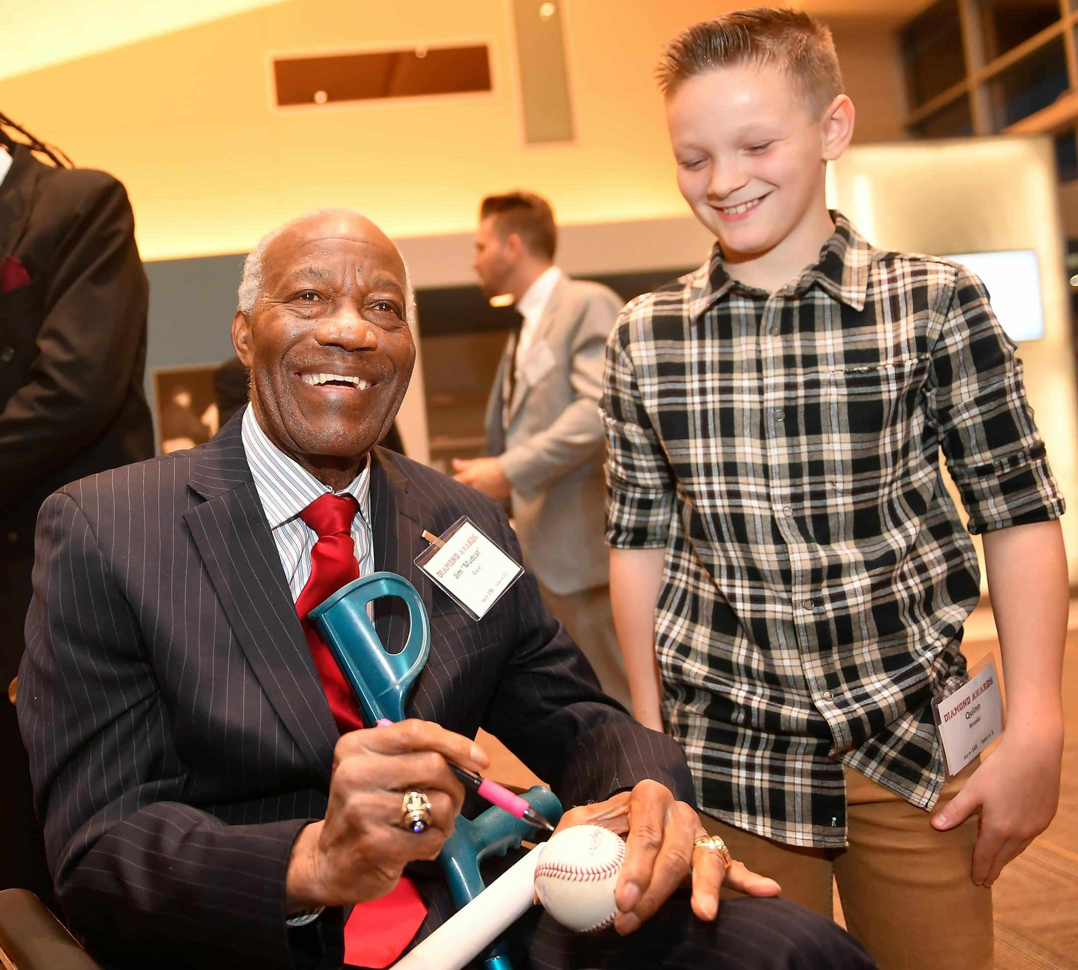 Jim "Mudcat" Grant, a World Series winning pitcher for the 1965 Minnesota Twins, smiled as he signed an autograph for Quinn Brooks, 11, of Sioux Falls, S.D., during a VIP event held before the 2017 Diamond Awards Thursday night. ] AARON LAVINSKY • aaron.lavinsky@startribune.com The Minnesota Twins held the 2017 Diamond Awards on Thursday, Jan. 26, 2017 at Target Field in Minneapolis, Minn.