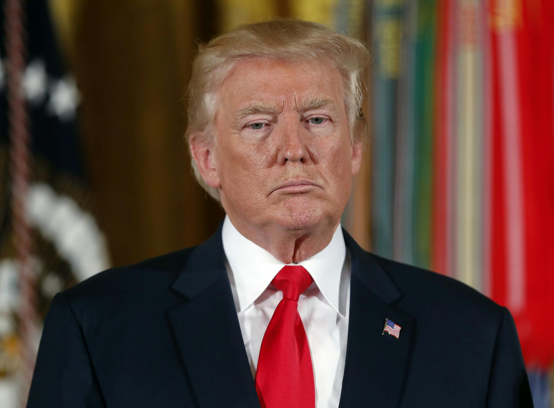 In this July 31, 2017, photo, President Donald Trump pauses during a ceremony in the East Room of the White House in Washington. Trump’s threat to stop billions of dollars in government payments to insurers and force the collapse of “Obamacare” could put the government in a tricky legal situation. Legal experts say he’d be handing insurers a solid court case, while undermining his own leverage to compel Democrats to negotiate, especially if premiums jump by 20 percent