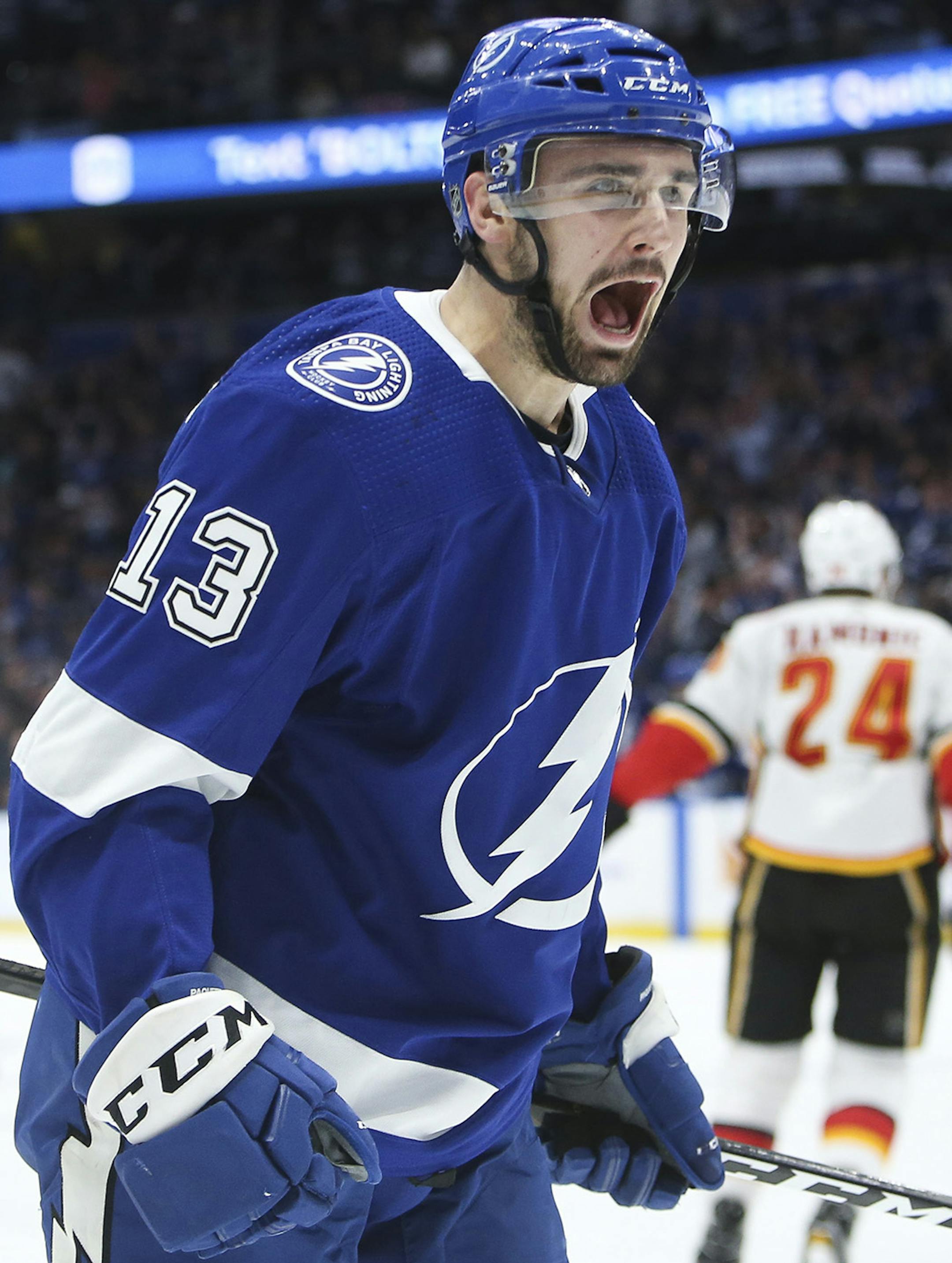 Tampa Bay Lightning center Cedric Paquette (13) celebrates his goal, beating Calgary Flames goaltender David Rittich (33) during first period action on Tuesday, Feb. 12, 2019 at Amalie Arena in Tampa, Fla. (Dirk Shadd/Tampa Bay Times/TNS)