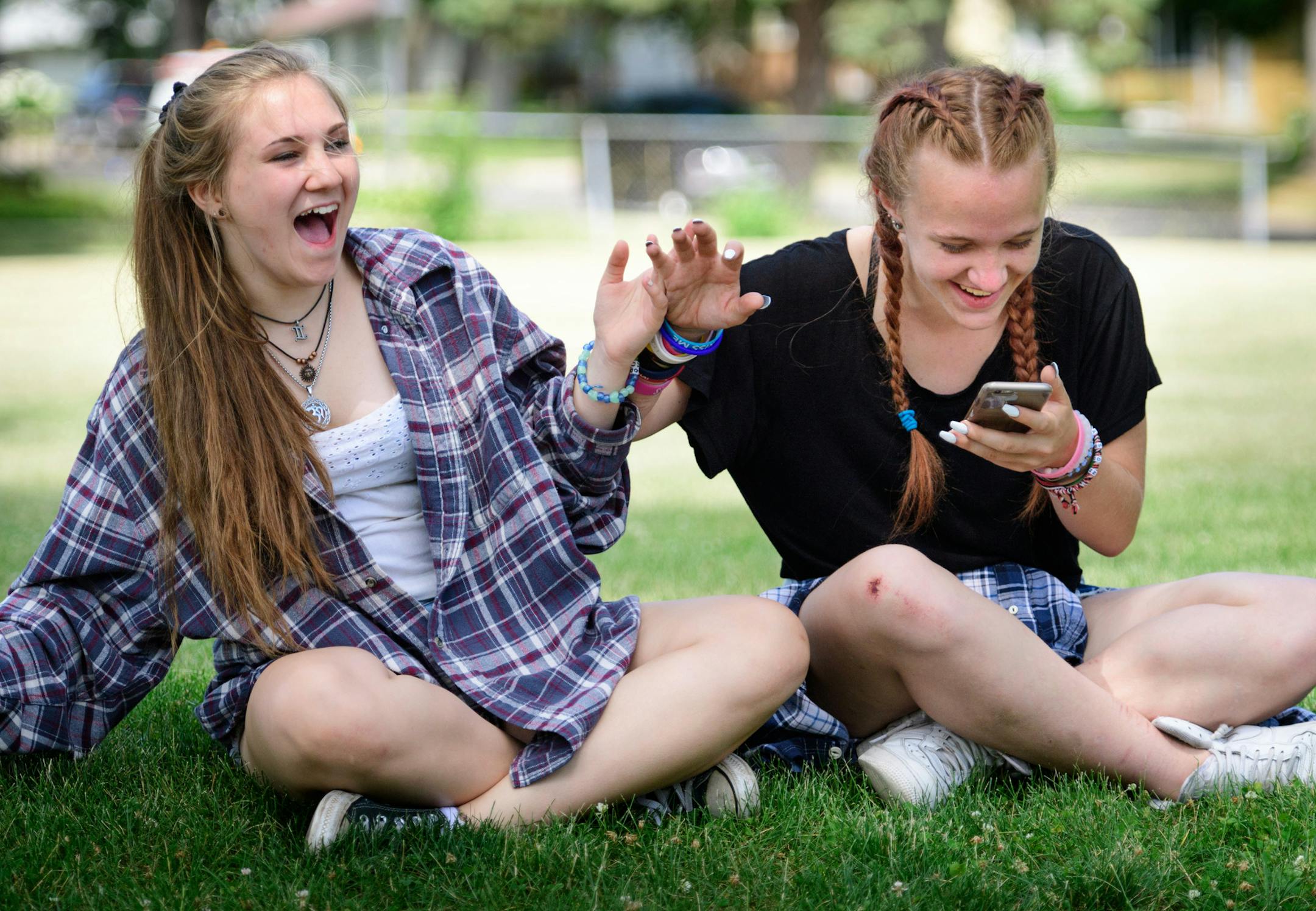 Haley Klun, 15, and her friend Chloe Bennett, 14, playfully pushed each other around after Haley Snapchatted a photo photo of Chloe’s skateboarding injury, a scraped right knee. The played a little basketball in a park near their Hopkins homes before sitting down to snapchat pictures of each other.