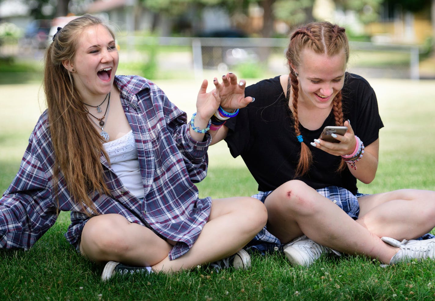 Haley Klun, 15, and her friend Chloe Bennett, 14, playfully pushed each other around after Haley Snapchatted a photo photo of Chloe&#x2019;s skateboarding injury, a scraped right knee. The played a little basketball in a park near their Hopkins homes before sitting down to snapchat pictures of each other.