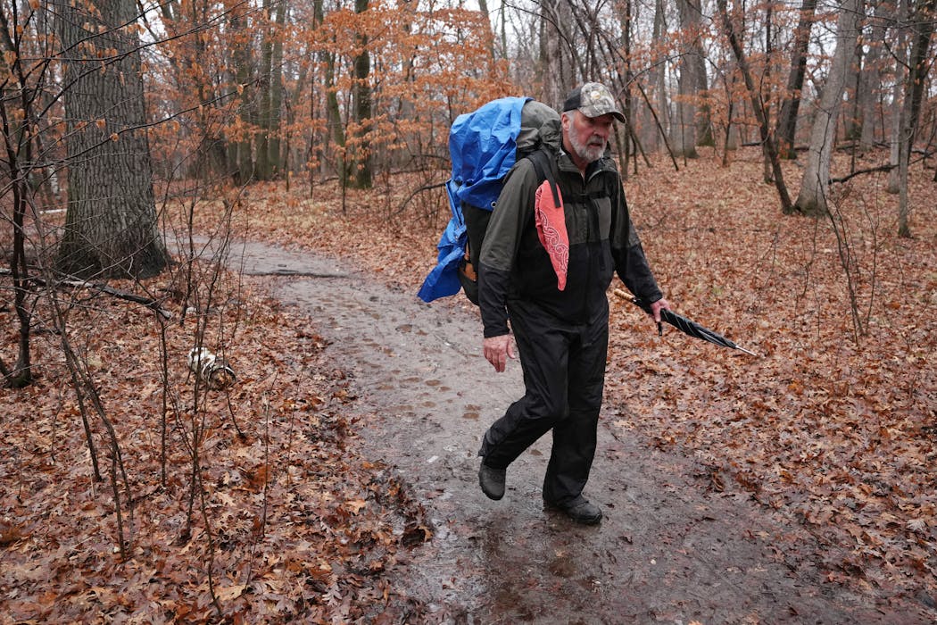 Bob Naslund hiked in the rain Feb. 8 to a backpack site at Lake Maria State Park near Monticello.