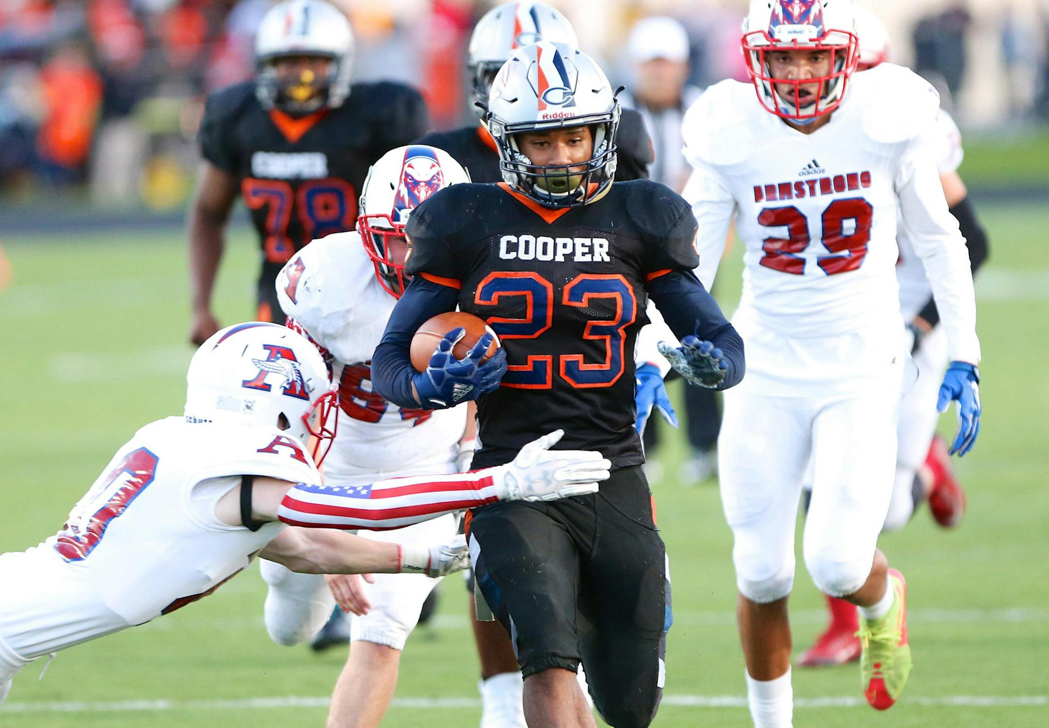 Cooper Hawk RB Onte Burns bursts up the middle for yardage against rival Robinsdale Armstrong at Cooper High School on Friday, Sept. 29. Photo by Brian W Nelson, SportsEngine