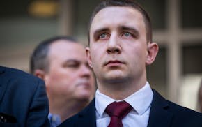 Trooper Ryan Londregan stood surrounded by security, his lawyers and dozens of supporters, including many officers, as his lawyer spoke to the media a