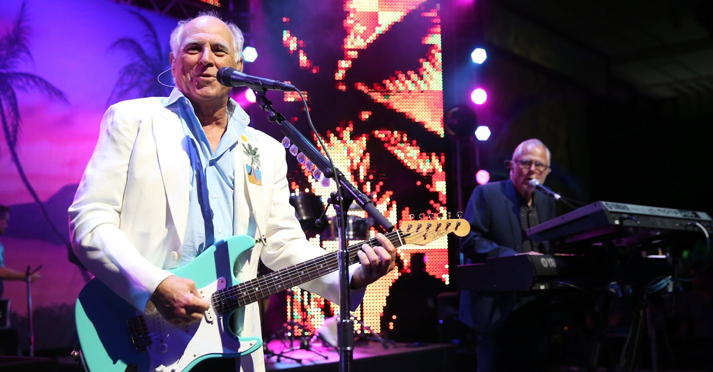 FILE - In this June 9, 2015 file photo, Jimmy Buffett performs at the after party for the premiere of "Jurassic World" in Los Angeles. Producers said Wednesday, Feb. 3, 2016, that a Jimmy Buffett musical, combining Buffett's blend of rock and country tunes with an original story by writers Greg Garcia and Mike O'Malley will open at the La Jolla Playhouse in California on May 16, 2017. (Photo by Matt Sayles/Invision/AP, File)