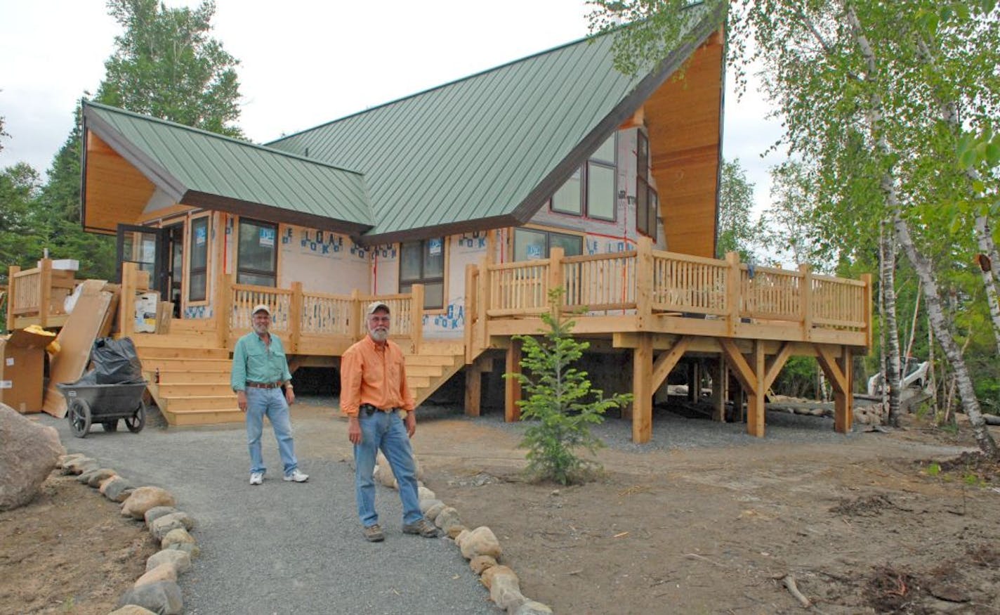 Ted and Bud Burger, former owners of Burger Brothers Sporting Goods stores in the Twin Cities, oversee their latest retirement project: construction of an island cabin on Lake of the Woods.