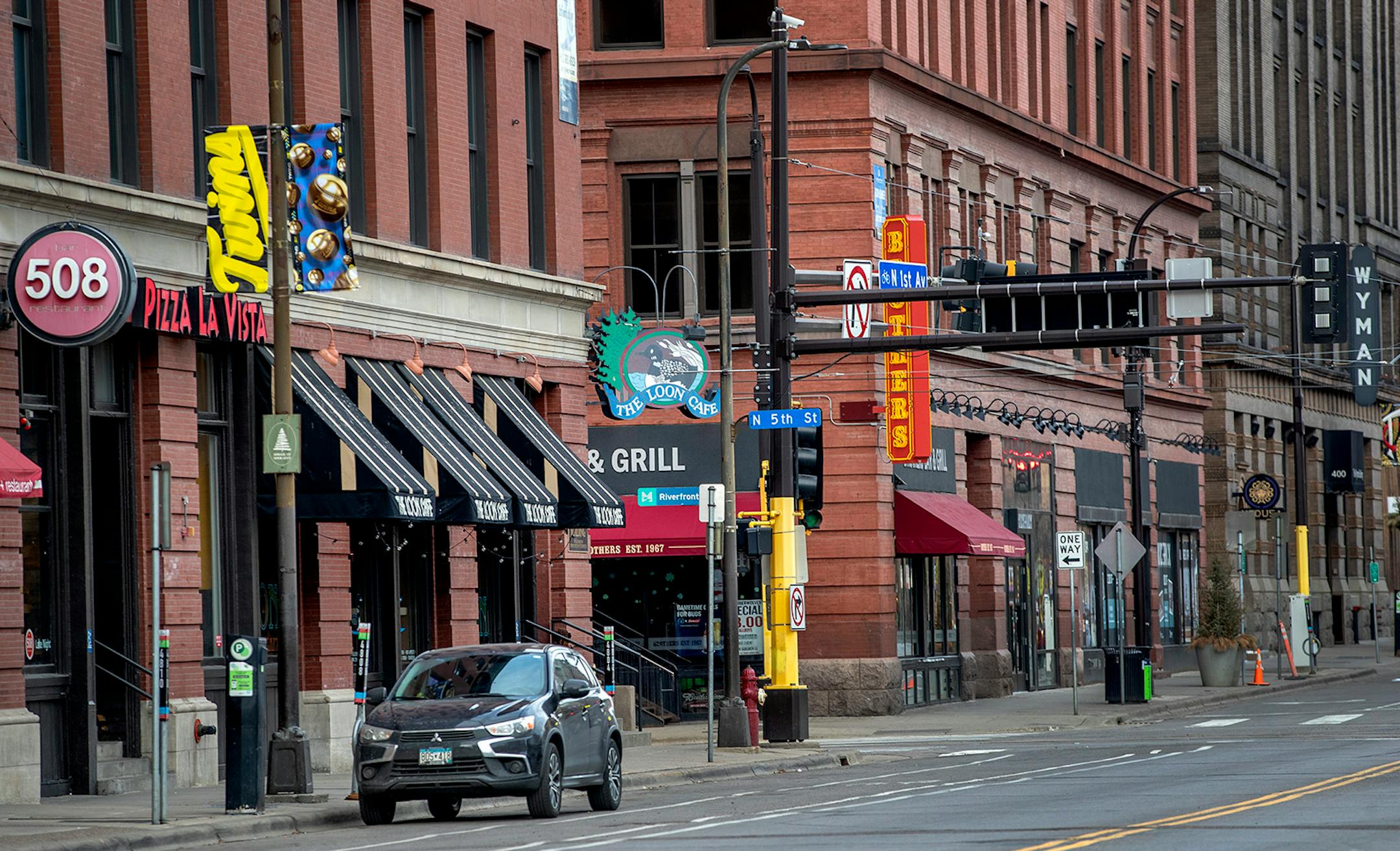 Bars on First Avenue in downtown Minneapolis that would normally be busy during happy hour on St. Patrick's Day were quiet on Tuesday after Day after a state order that closed bars and restaurants.
