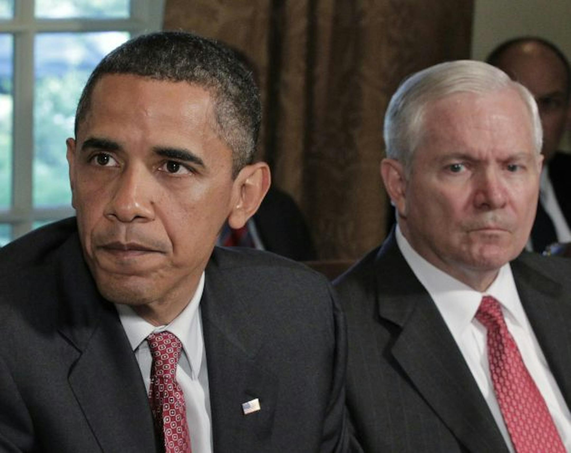President Barack Obama, joined by Secretary of Defense Robert Gates at right, tells reporters during a Cabinet meeting that he thinks Gen. Stanley A. McChrystal, the commander of Western forces in Afghanistan, used "poor judgement" in speaking candidly during an interview with Rolling Stone magazine, in the Cabinet Room at the White House in Washington, Tuesday, June 22, 2010. Gen. McChrystal has been summoned to Washington to answer for the unflattering remarks about senior Obama Administration
