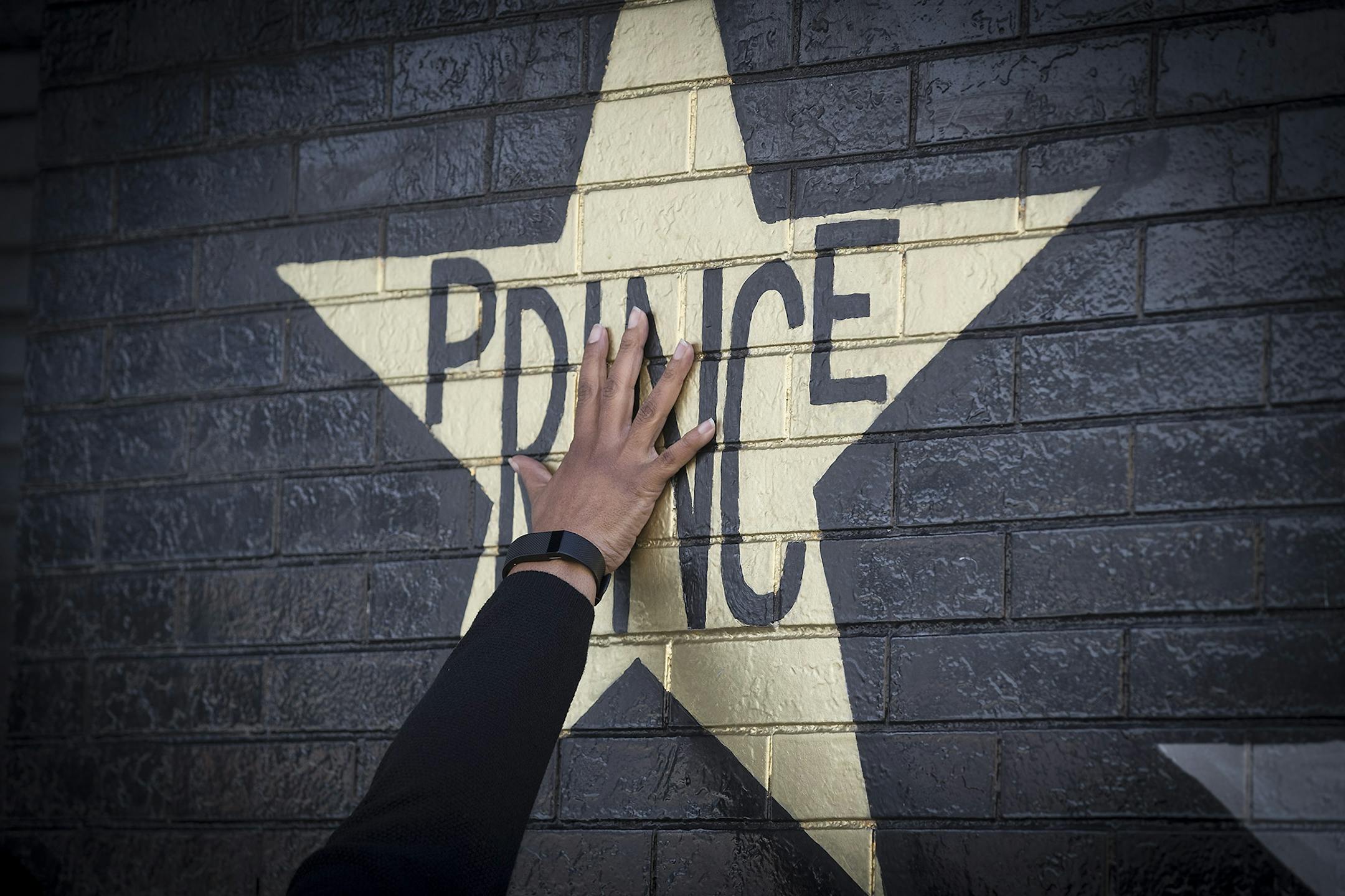 Many fans touched the Prince star on the exterior of First Avenue nightclub to remember him on the first anniversary of his death, Friday.