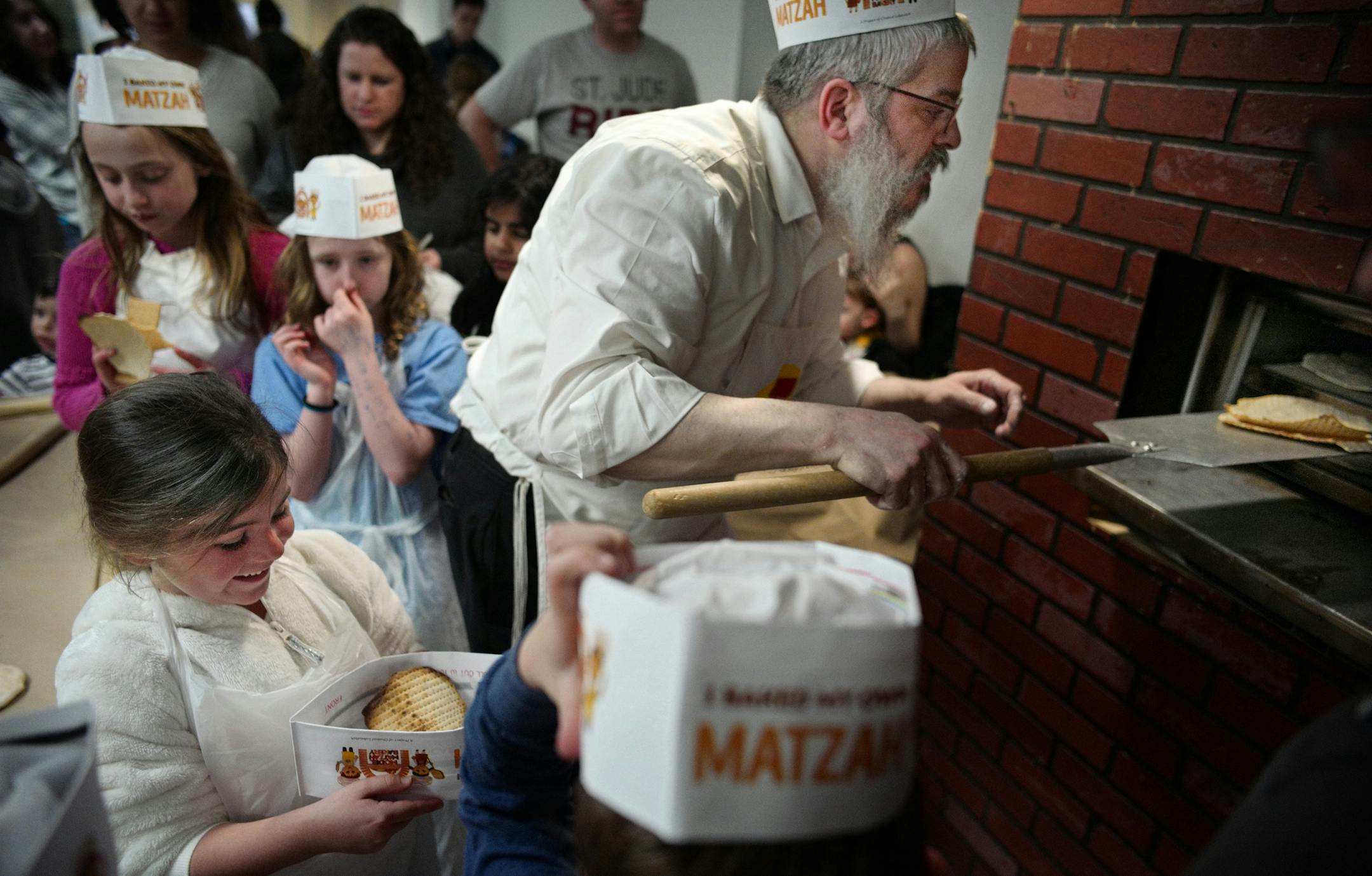 Rabbi Mordechai Grossbaum baked some thinly rolled and perforated dough in the oven. They are ready in less than five minutes.]The Model Matzah Bakery will be open to the general public Sunday April 2, at the Sabes Jewish Community Center. Participants will get to eat matzah baked from scratch. Richard Tsong-Taatarii/richard.tsong-taatarii@startribune.com