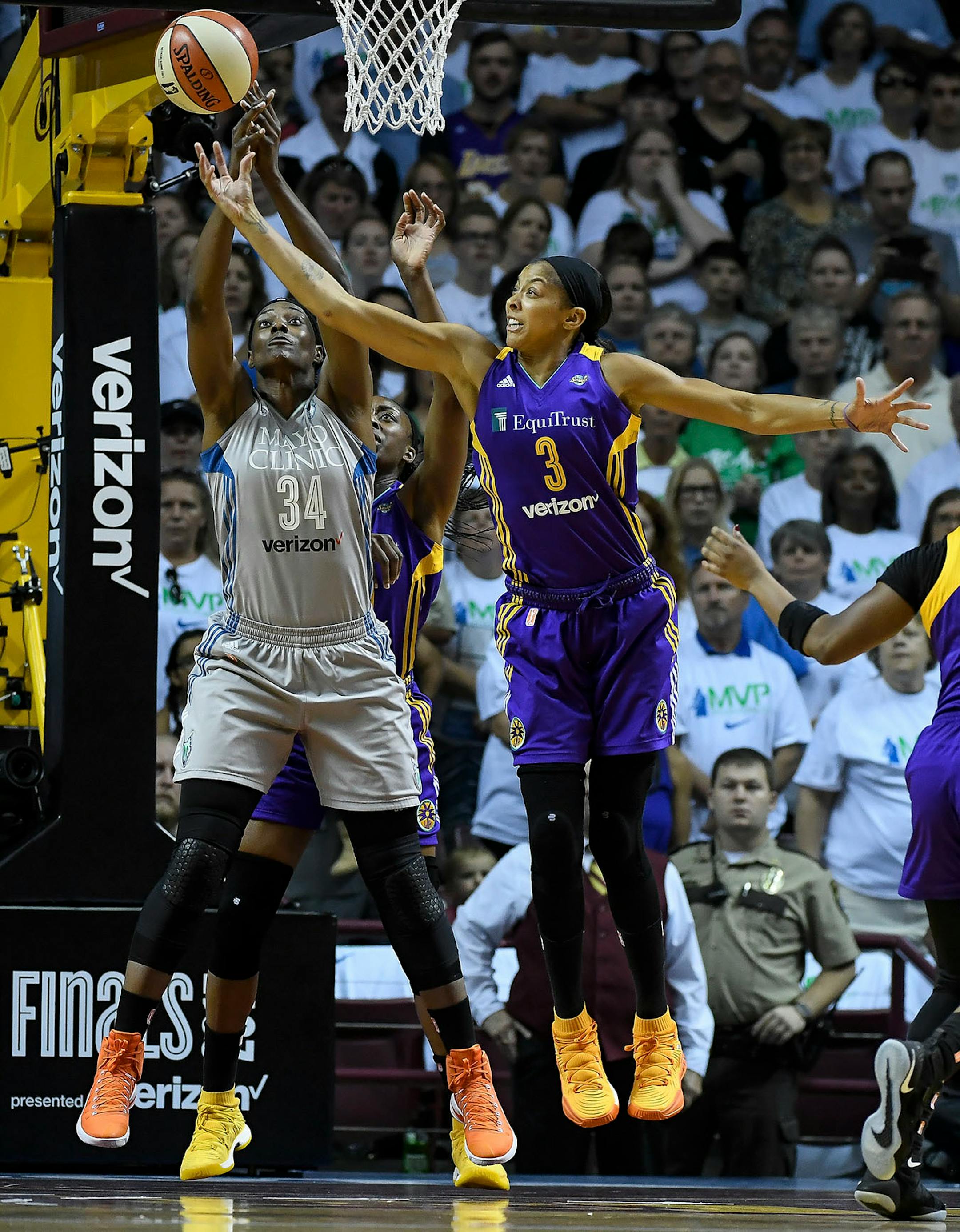 Los Angeles Sparks forward Candace Parker (3) won a rebound battle against Minnesota Lynx center Sylvia Fowles (34) in the first quarter.