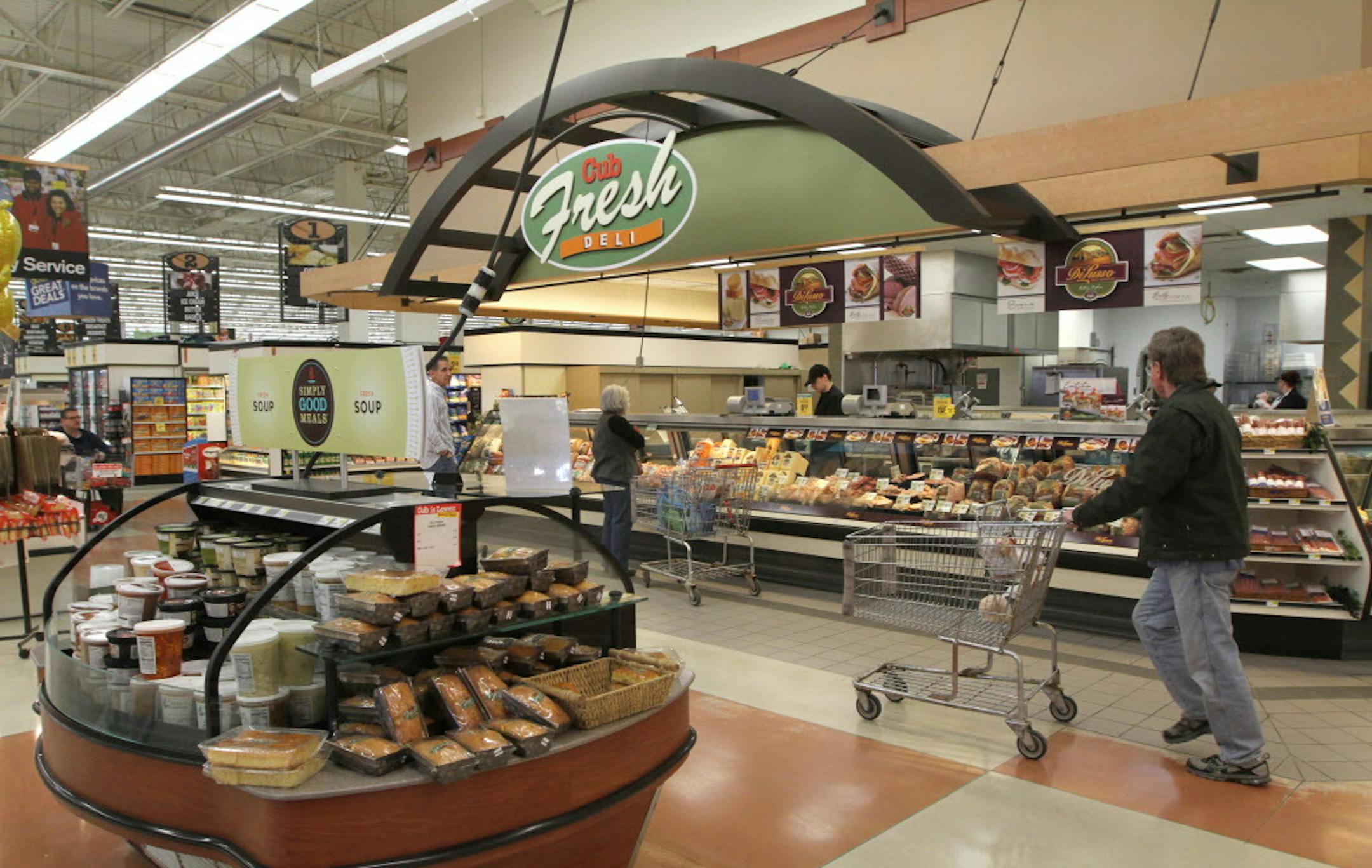 Customers walked through the fresh deli area of the Stillwater flagship store on 4/3/13. With Supervalu's $3.3 billion deal done and the company now half the size it used to be, Cub Foods is its largest conventional grocery chain remaining, as measured by number of stores. We talk with Cub President Brian Audette about the chain's future in the Twin Cities, where it is the largest grocery operator. Will look at it plans to deal with increasing pressure from low price leaders like Wal-mart and wh