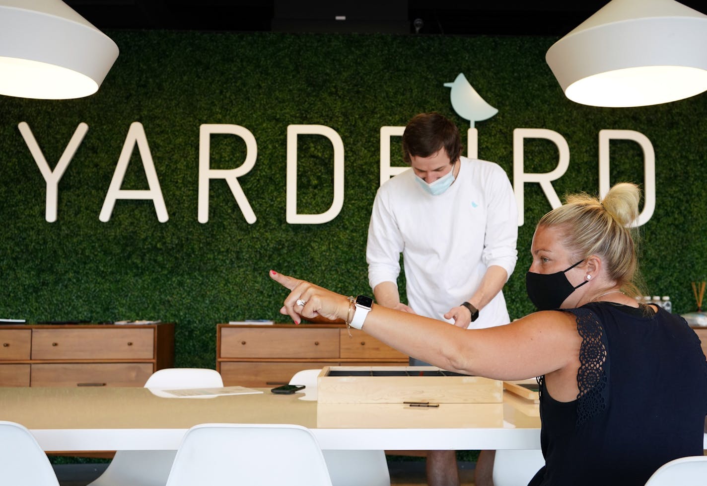 Store manager Matt McCracken helped customer Kelsey Johnson of Edina lay out her patio on a chalk board as they talked through the options for outdoor furniture Wednesday. ] ANTHONY SOUFFLE • anthony.souffle@startribune.com Yardbird Patio Furniture co-owner Jay Dillon helped customers Kelsey and Matt Johnson of Edina as they looked to outfit their backyard patio Wednesday, July 1, 2020 at the company's showroom in St. Louis Park, Minn. Yardbird is having $1 million sale weeks as people desperate