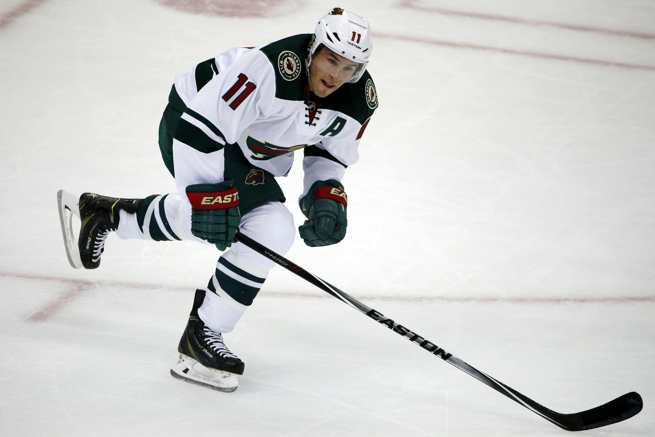 Minnesota Wild's Zach Parise (11) skates in the first period of a NHL pre-season hockey game against the Pittsburgh Penguins in Pittsburgh Thursday, Sept. 25, 2014. (AP Photo/Gene J. Puskar)