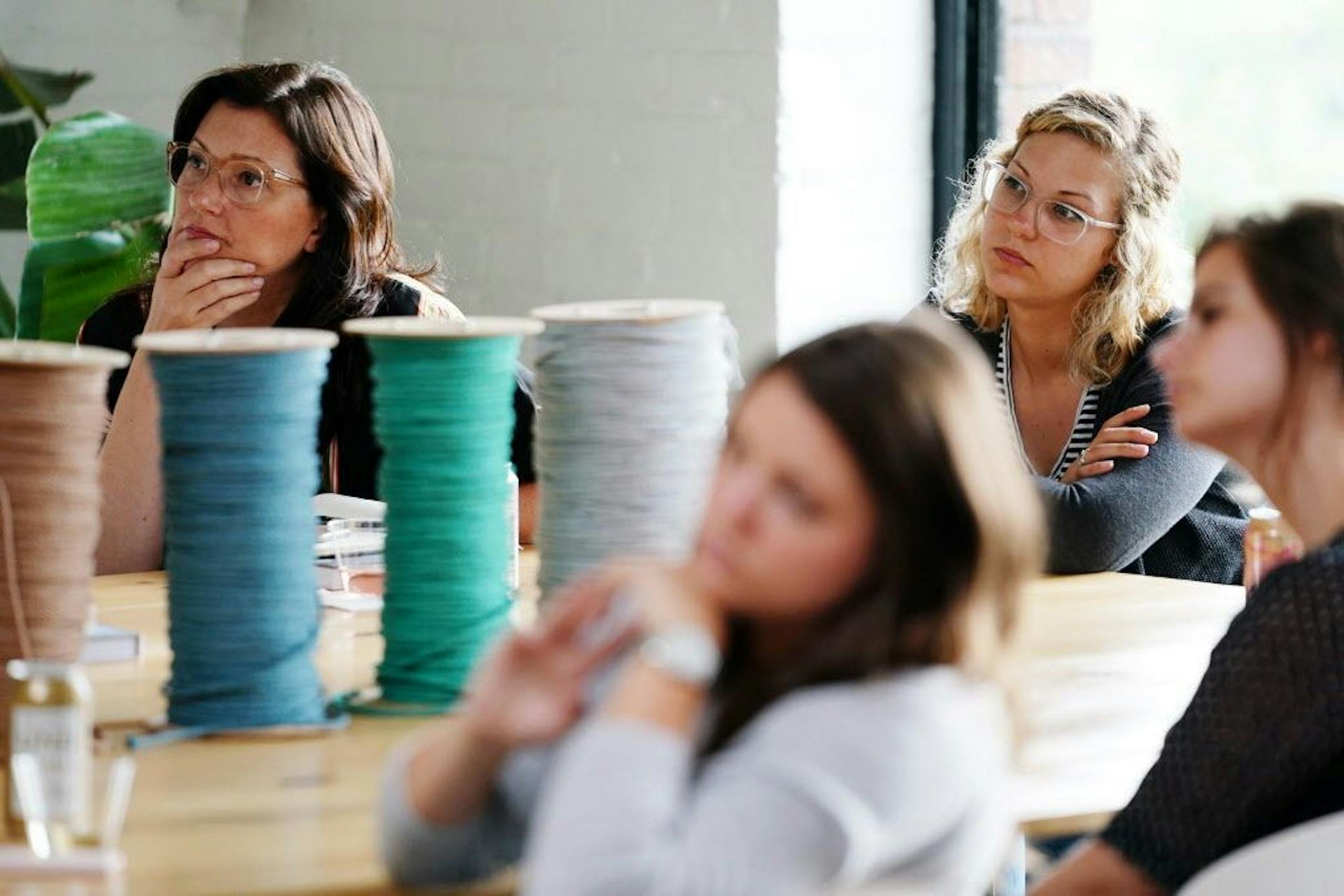 Students watched as Emily Katz demonstrated the basic techniques of the craft during her macrame class.