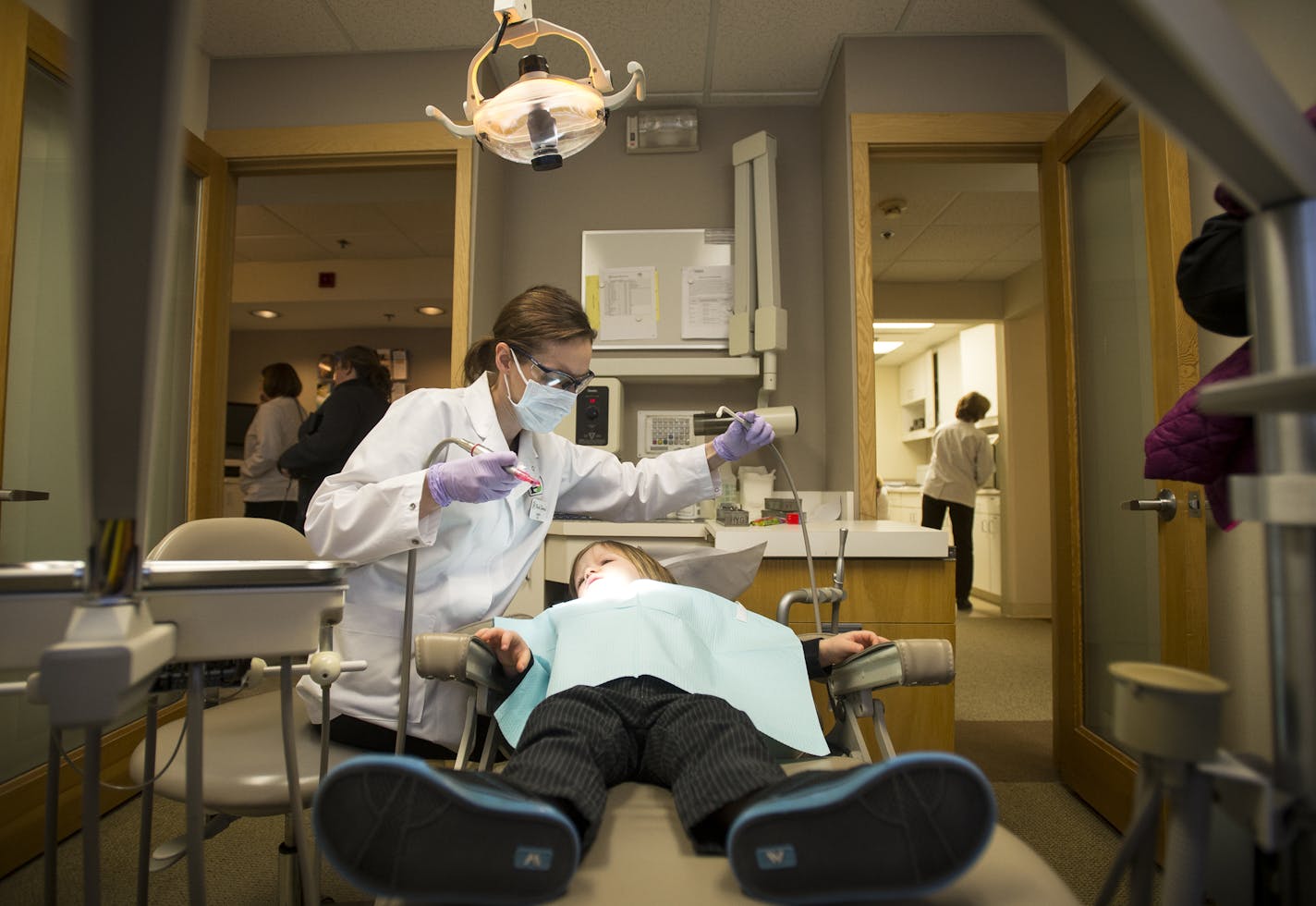 Dental hygienist Laura Ratcliffe cleaned the teeth of Riggs Bergstrom, 3, of Buffalo, Friday afternoon during a free dental care clinic for children in need at Park Dental in Minnetonka. ] (AARON LAVINSKY/STAR TRIBUNE) aaron.lavinsky@startribune.com The U of M is asking the Legislature for $1 million to keep its mobile dental lab on the road, citing the need to serve low-income families and train dental students. We photograph the annual free dental care clinic put on by Minnesota dentists on Fr