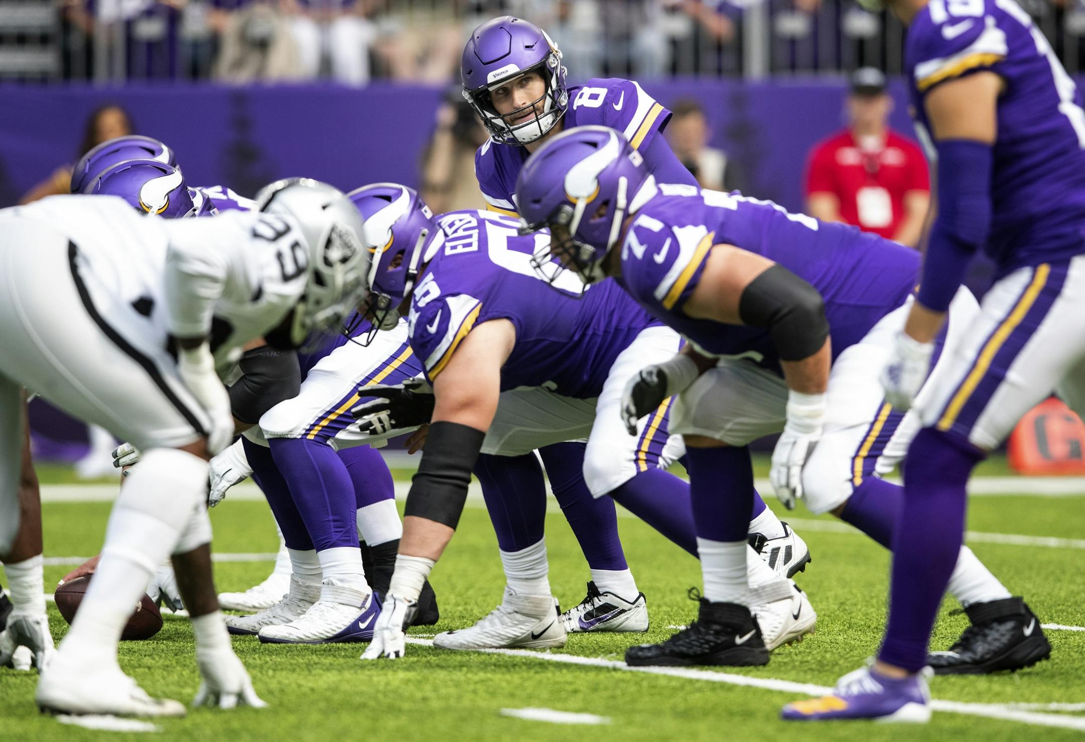 Minnesota Vikings quarterback Kirk Cousins (8) and offensive line.